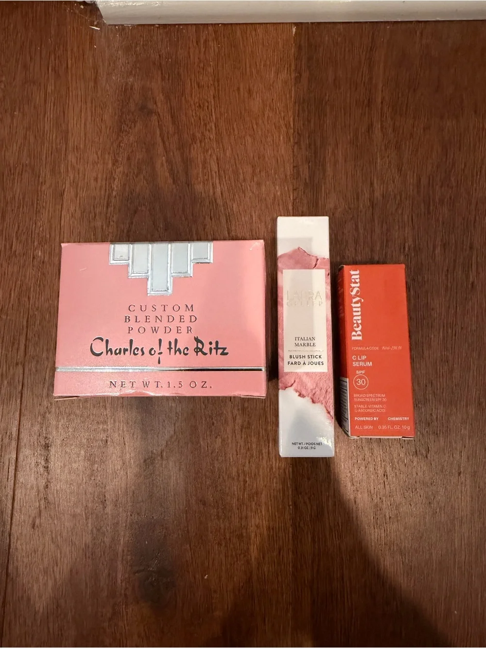 Laura Geller Pink Blush Stick & Lip Serum and charles of the ritz powder